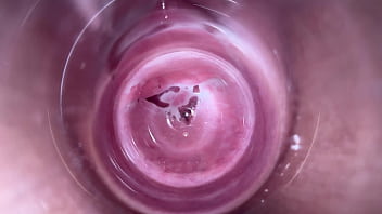 Camera deep inside nubile milky fluid colored puss